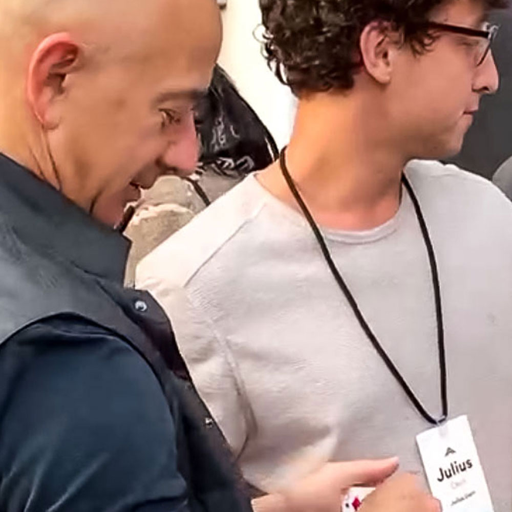 Julius Dein doing magic with Jeff Bezos, CEO of Amazon 